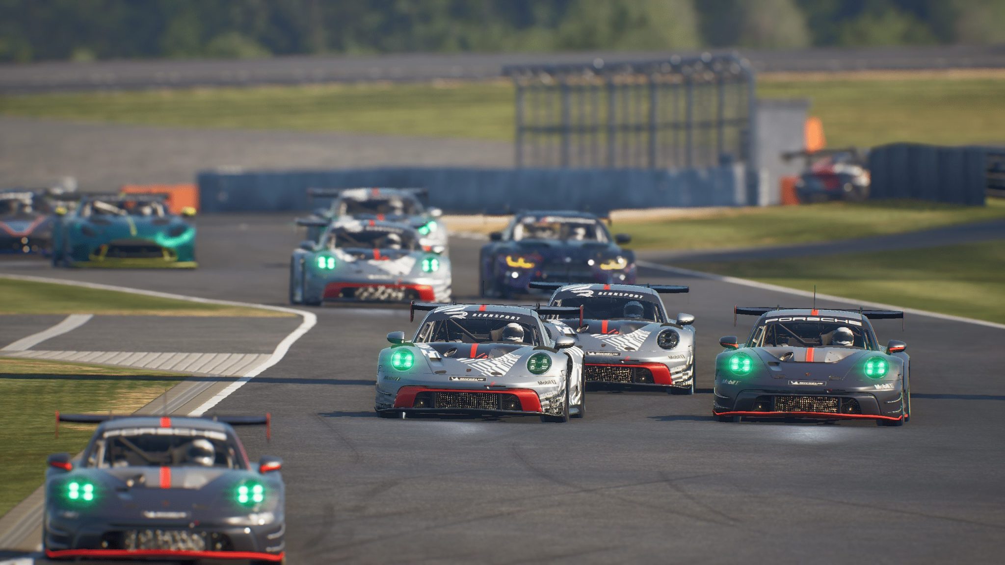 Un peloton de Porsche 911 GT3 R en course dans Rennsport