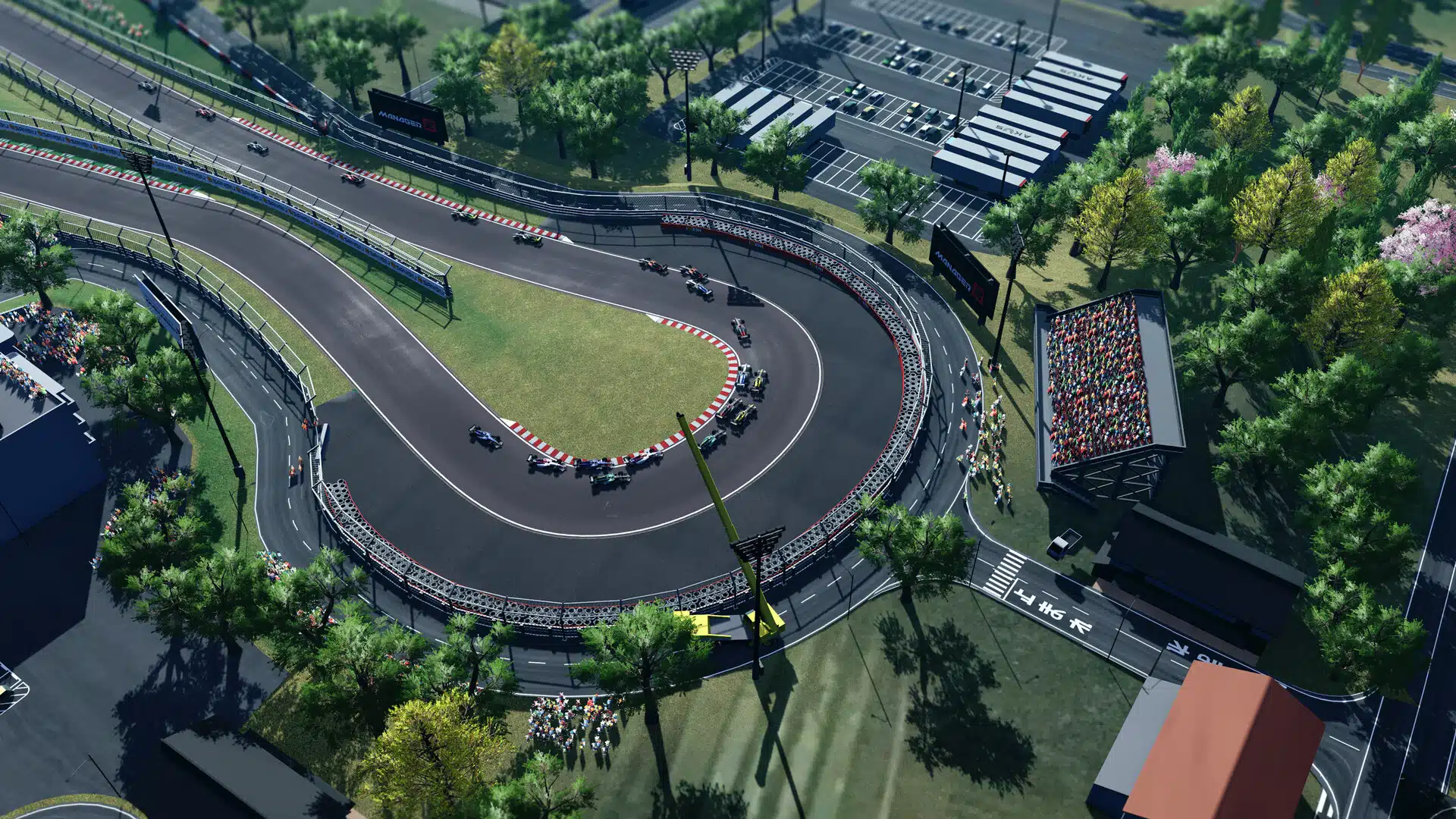 Une épingle vue du ciel, avec les monoplaces en file, dans Motorsport Manager 2