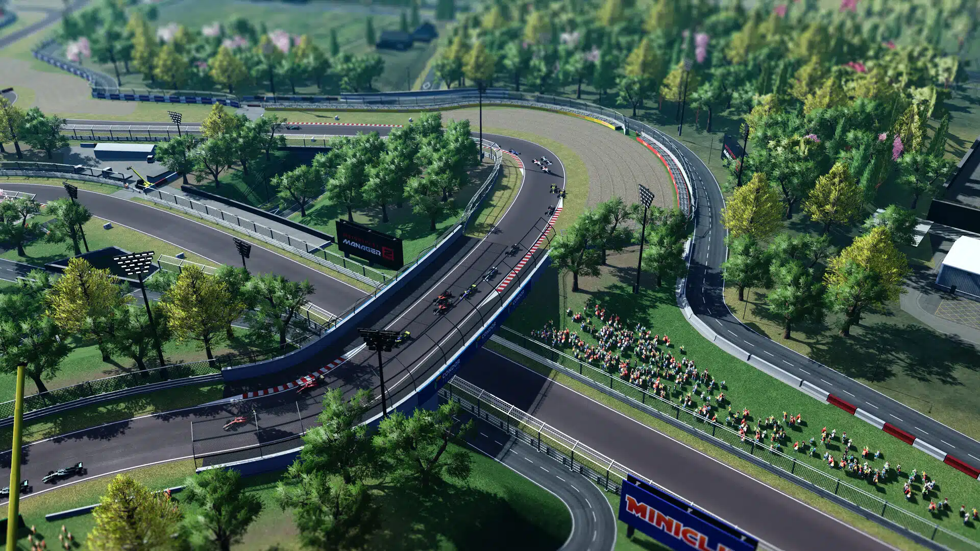 Le croisement en pont d’un circuit boisé, dans Motorsport Manager 2