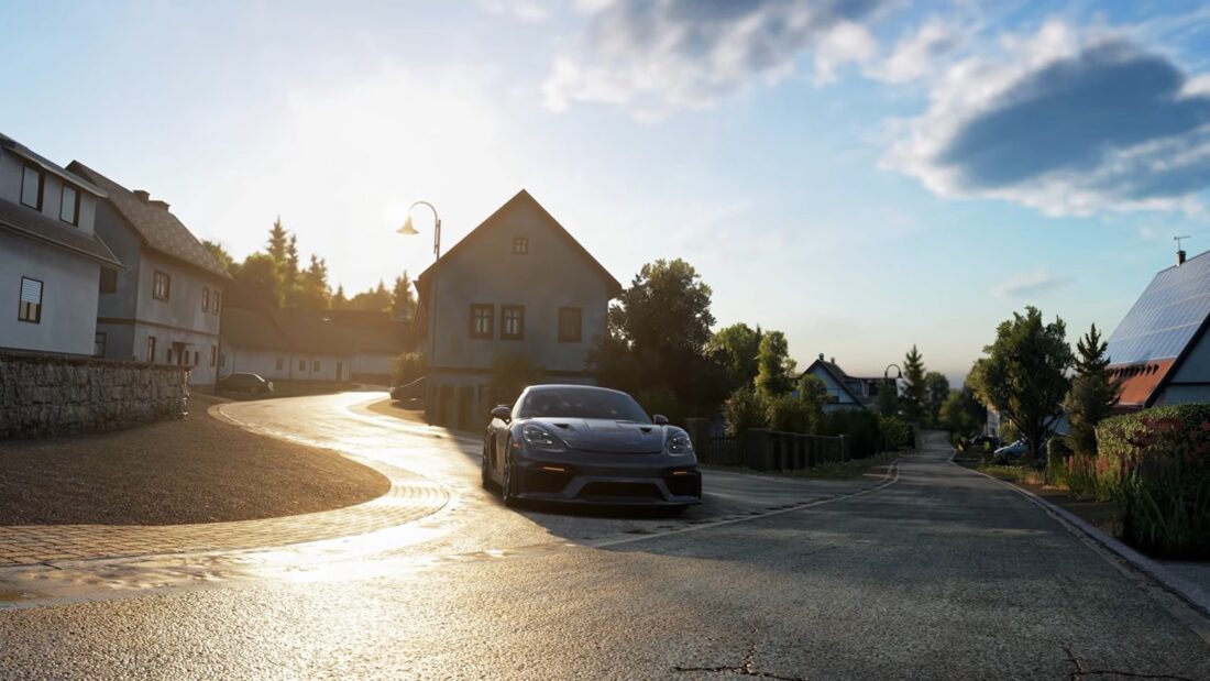 Une sportive grise dans une rue de village de l'Eifel au coucher du soleil, dans le free roam d'Assetto Corsa EVO