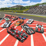 Les onze voitures du Project Motor Racing World Endurance Pack sur la grille de Fuji Speedway, le mont Fuji en arrière-plan